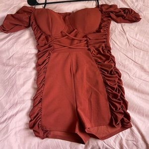 Burgundy romper , by Papaya in the size L.